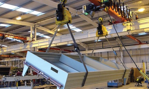 Overhead cranes lifting fabricated steel components